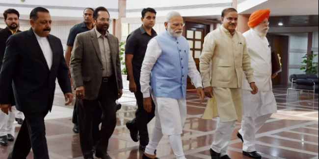 Image result for Prime Minister Narendra Modi colleagues with laddoos as the ruling BJP's lawmakers held their first meeting